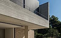 012-residence-in-dionysos-monolithic-concrete-dwelling-nestled-in-penteli.jpg