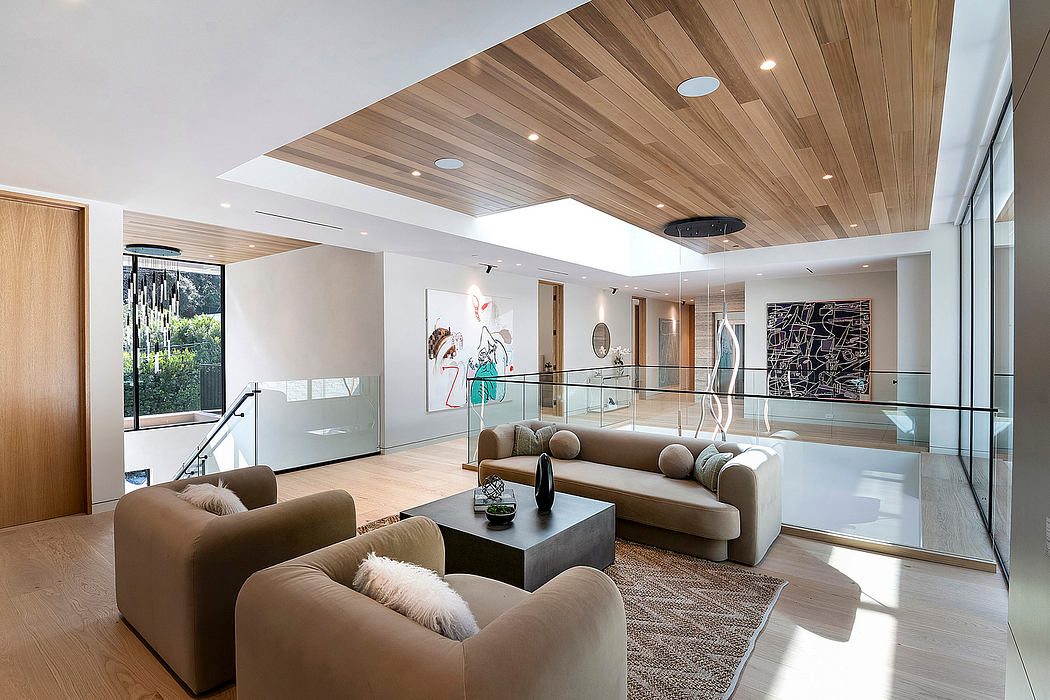 Sleek, modern living space with wooden ceiling, glass walls, and contemporary furnishings.