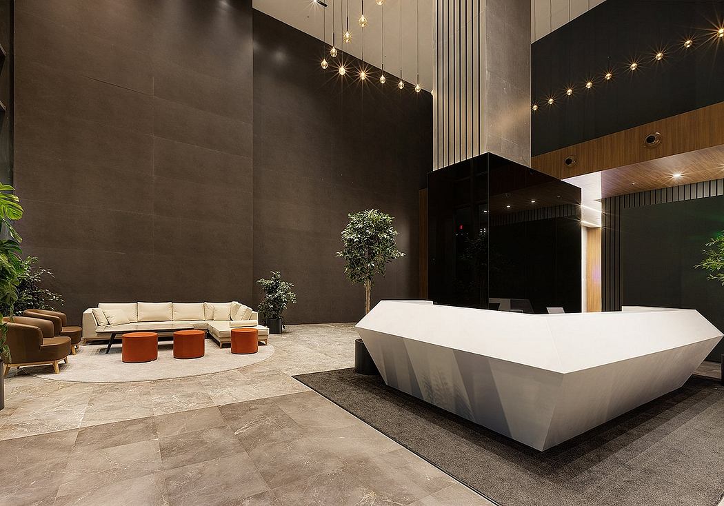 A modern, minimalist lobby with sleek furniture, lighting, and a striking white reception desk.
