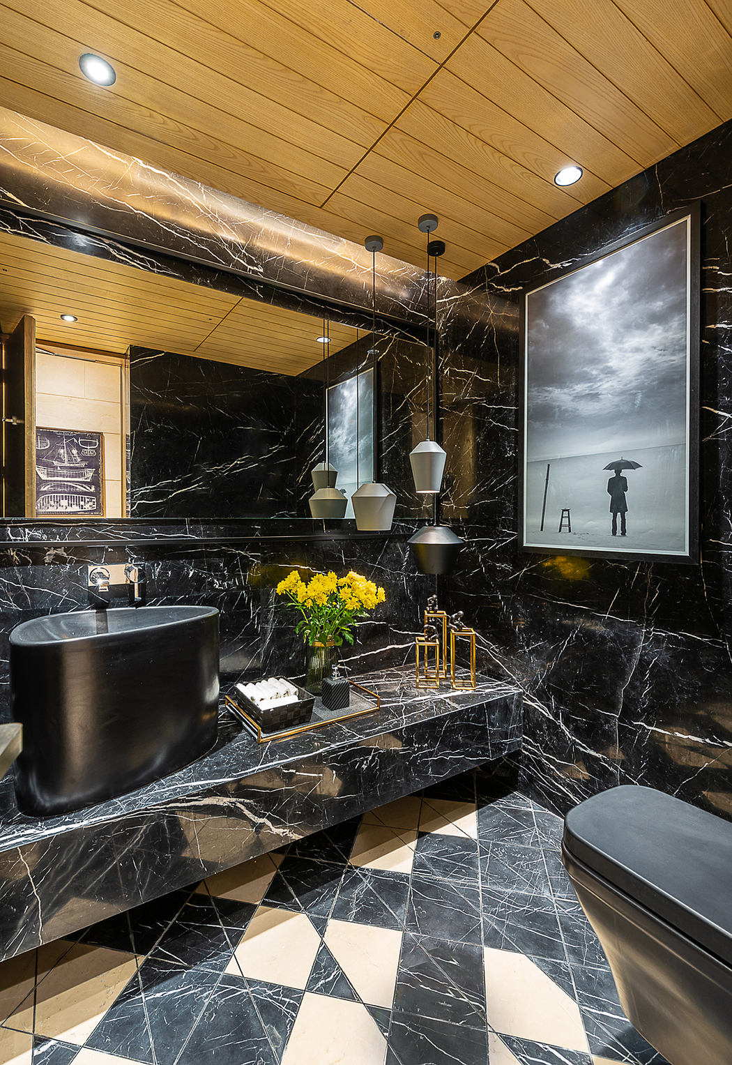 Luxurious modern bathroom with black marble walls, wooden ceiling, and artistic decor.