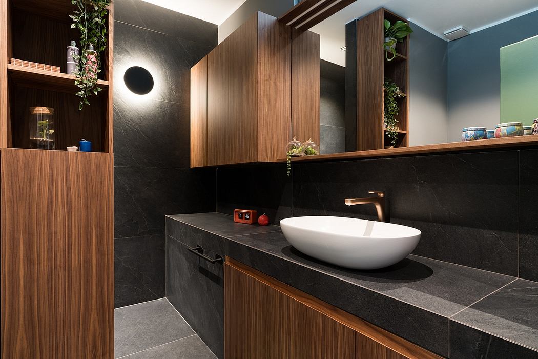 Modern bathroom with sleek wood and stone elements, minimalist design.
