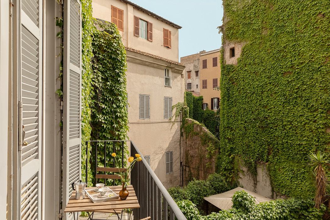 Charming ivy-covered buildings with shuttered windows, balconies, and lush greenery.