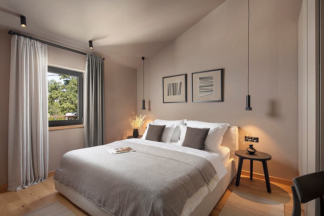 Spacious, modern bedroom with floor-to-ceiling windows, neutral tones, and minimalist decor.