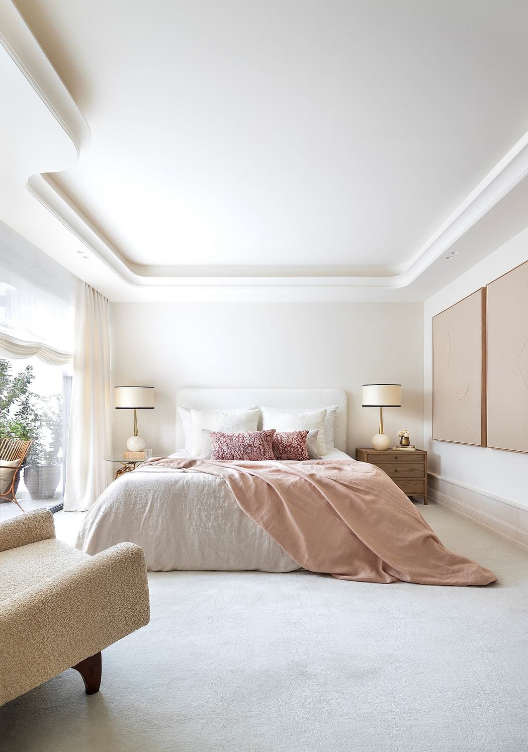 A spacious, well-designed bedroom featuring a plush bed, soft lighting, and a harmonious color palette.