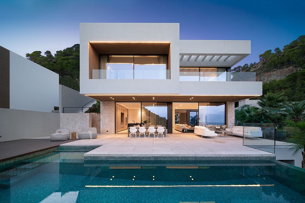 Stunning modern coastal villa with sleek lines, open living spaces, and an inviting pool.