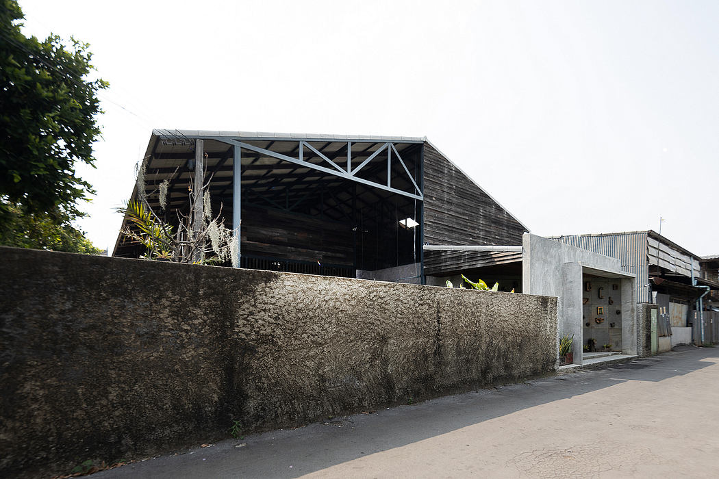 Rugged industrial warehouse with exposed beams and weathered concrete walls.