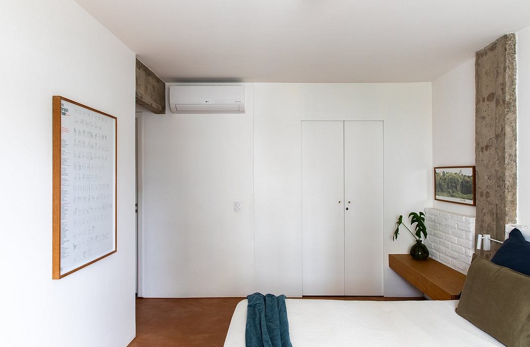 Minimalist and modern bedroom design with white walls, concrete accent, and built-in storage.