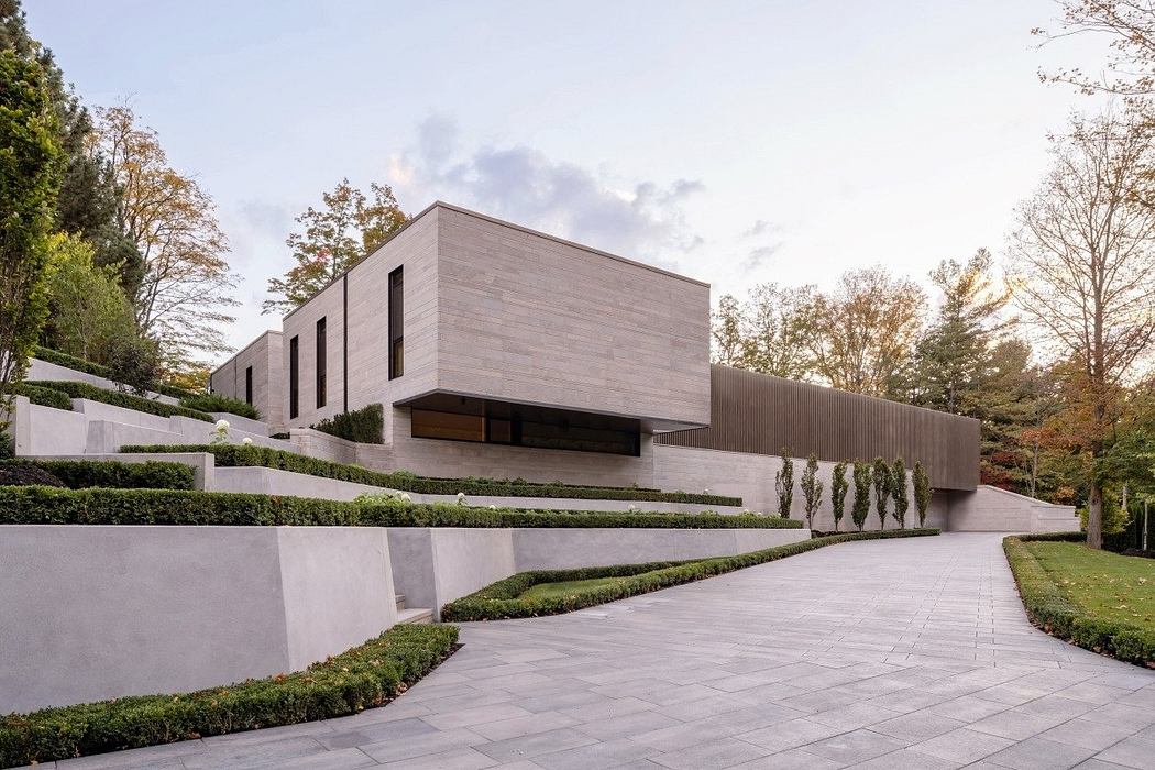 A modern, minimalist building with clean lines, geometric shapes, and natural materials.