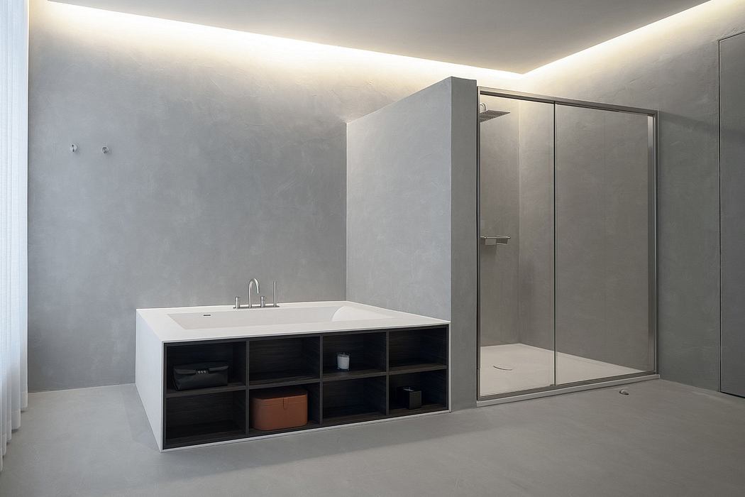 Minimalist bathroom design with storage cabinet, mirrored shower, and recessed lighting.