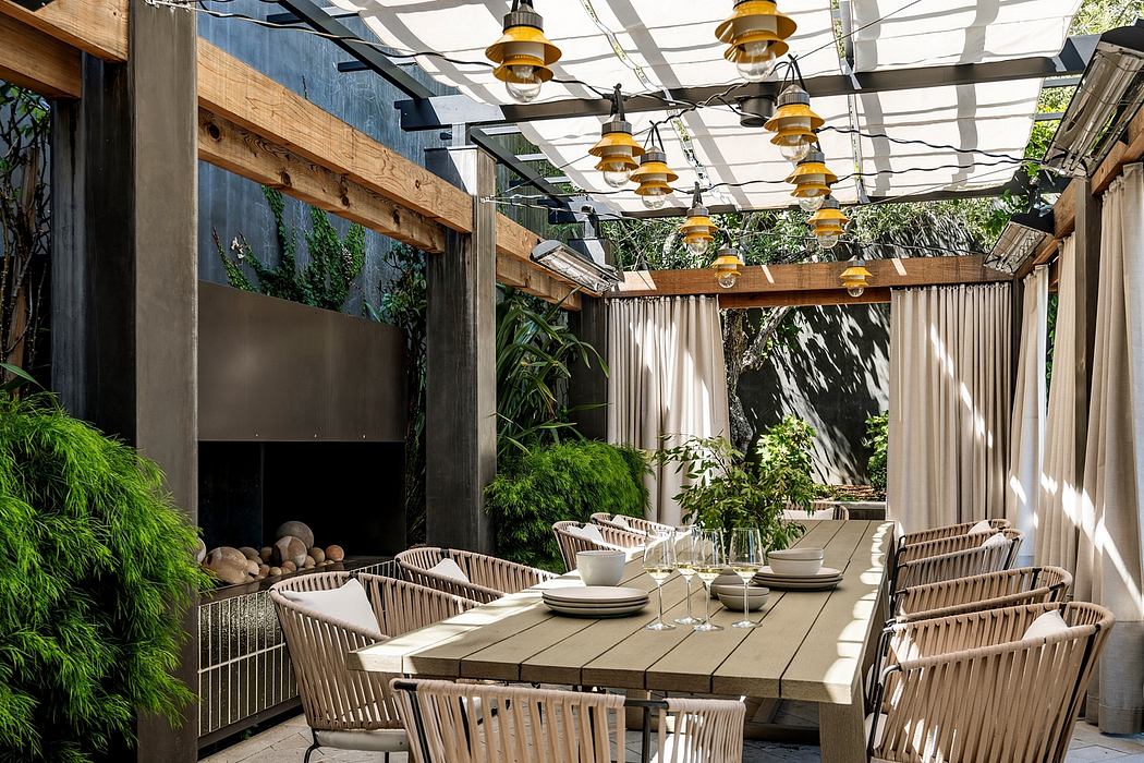 Vibrant outdoor patio with wooden decor, hanging lamps, and a cozy dining setup.