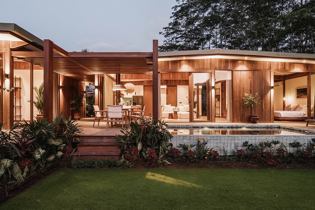 Contemporary wooden structure with inviting outdoor living space, pool, and landscaping.