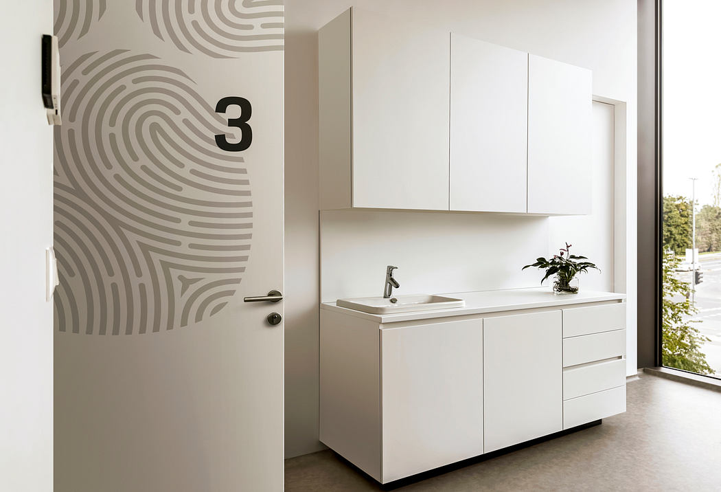 Clean, minimalist bathroom vanity with wall cabinets and patterned accent wall. Modern, functional design.
