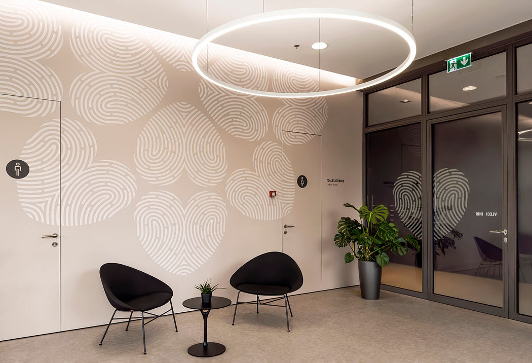 Modernist interior design with geometric wallpaper, circular lighting, and minimalist furniture.