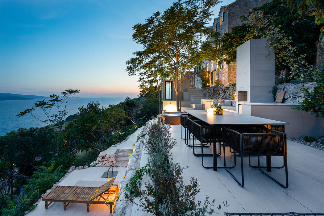 A picturesque outdoor dining area with modern furnishings overlooking a scenic vista.