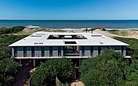 001-big-fish-elevated-home-blends-with-uruguays-wild-dunes.jpg