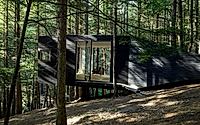 001-half-tree-house-unique-cabin-built-among-trees.jpg