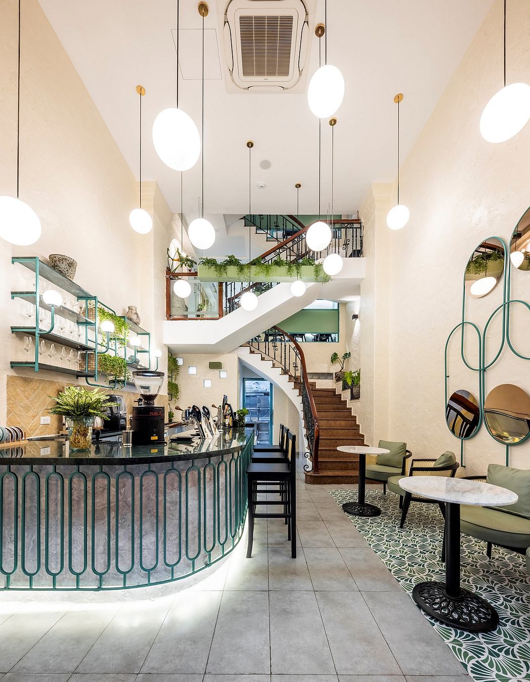 Sleek and modern interior design with metallic accents, spiral staircase, and lush greenery.