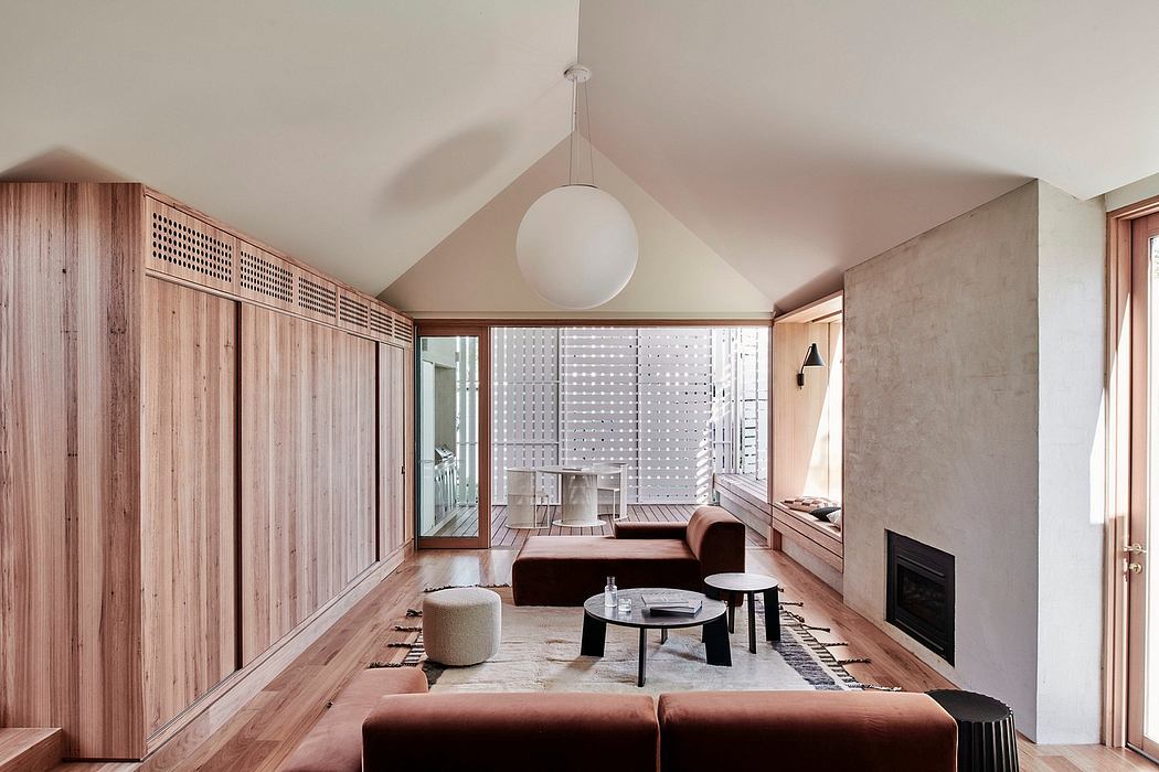 Spacious modern living room with wooden accents, minimalist decor, and sliding glass doors.
