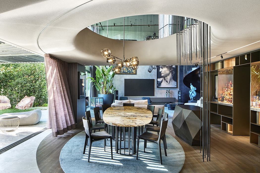 Stunning modern open-concept living area with curved ceiling, pendant lighting, and wooden dining table.