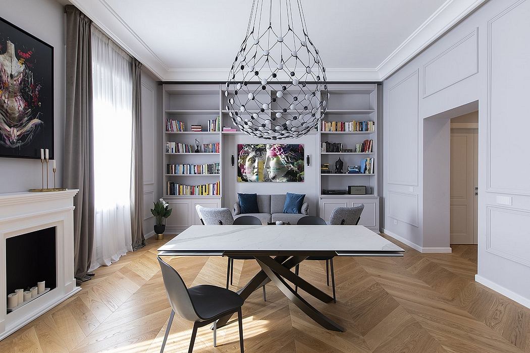 A sophisticated living room with a modern chandelier, built-in shelving, and herringbone wood floors.
