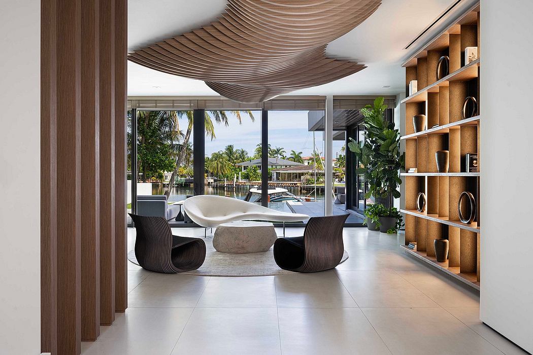 Sleek, modern living space with undulating wooden ceiling, floor-to-ceiling windows, and built-in shelving.