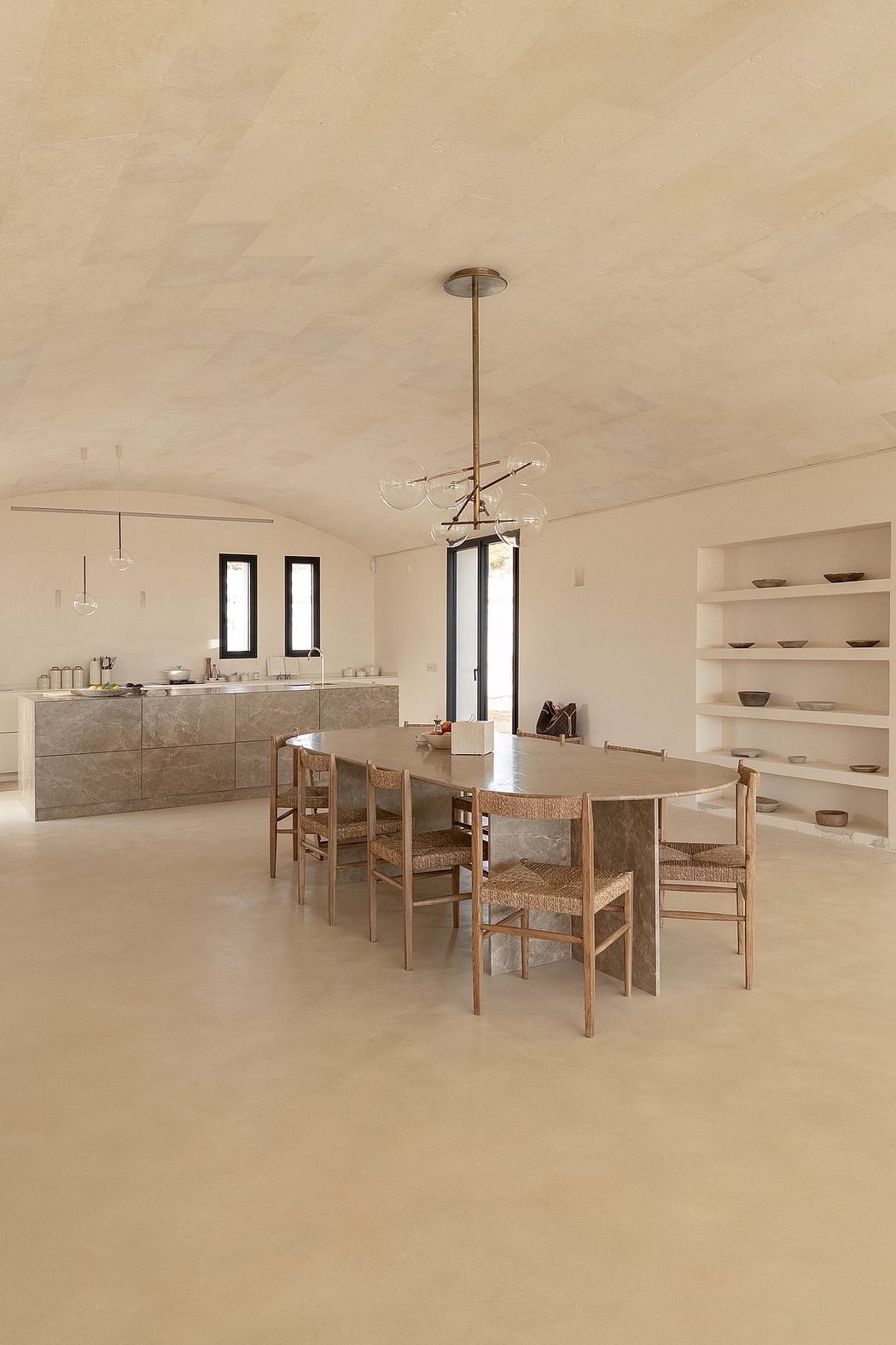 Spacious open-plan kitchen and dining area with modern, minimalist design.