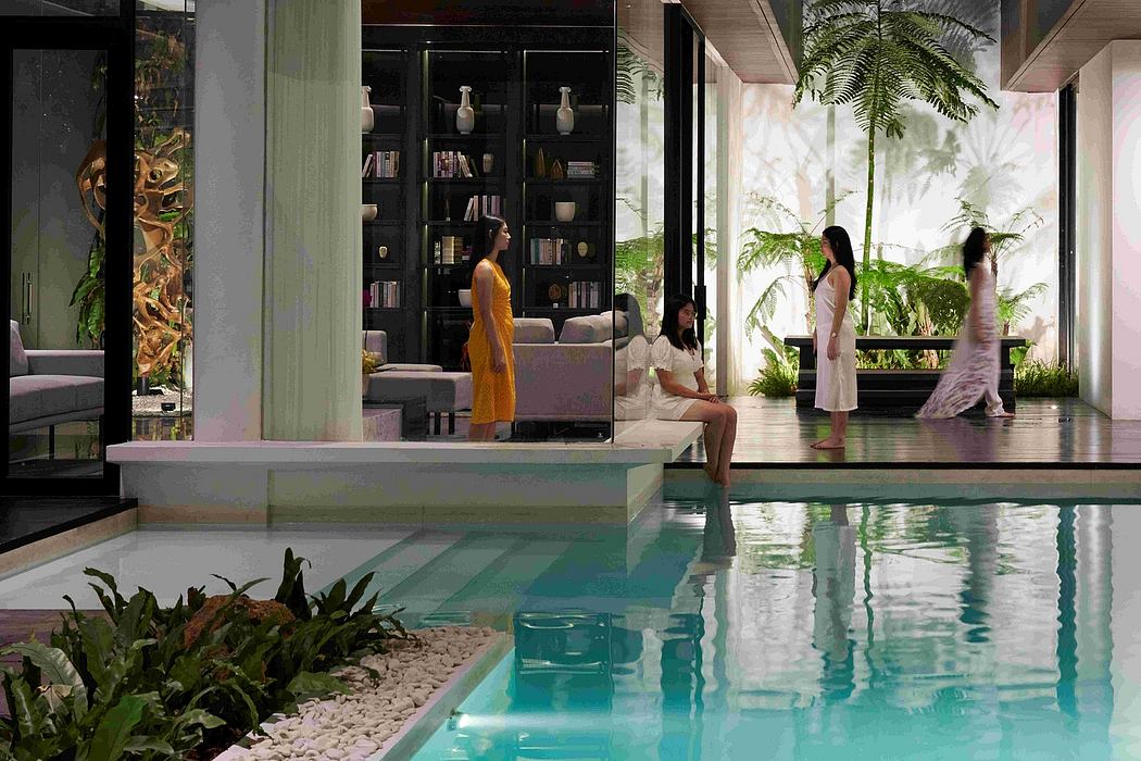 Luxurious indoor pool surrounded by lush greenery and contemporary furnishings.