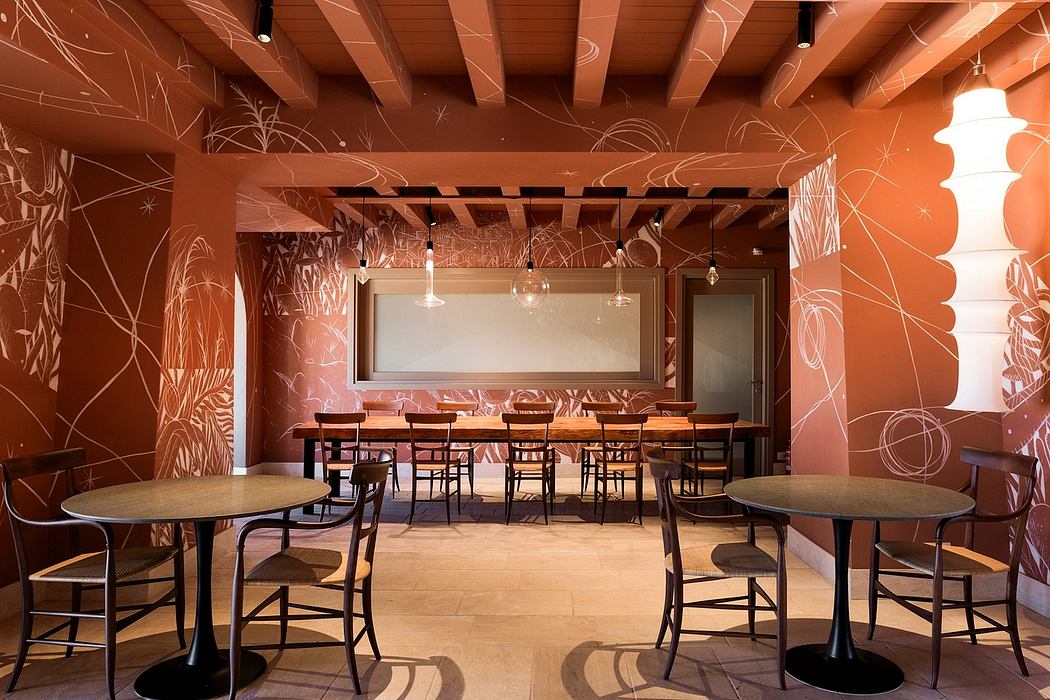 A cozy, rustic-inspired dining area with wooden beams, stylized wall murals, and modern furnishings.