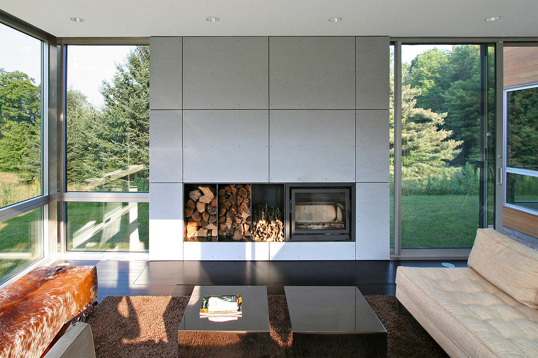 Modern minimalist living room with a wood-burning fireplace and ample natural light.