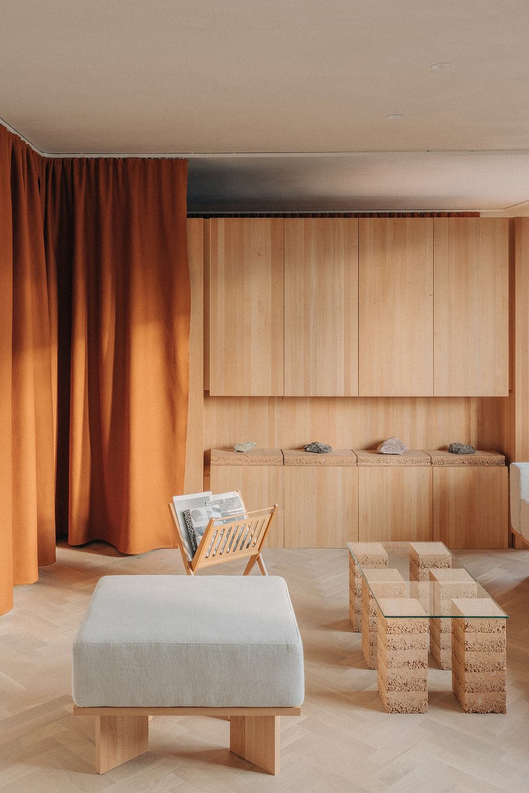 Warm-toned wooden interior with custom cabinets, plush seating, and natural stone accents.