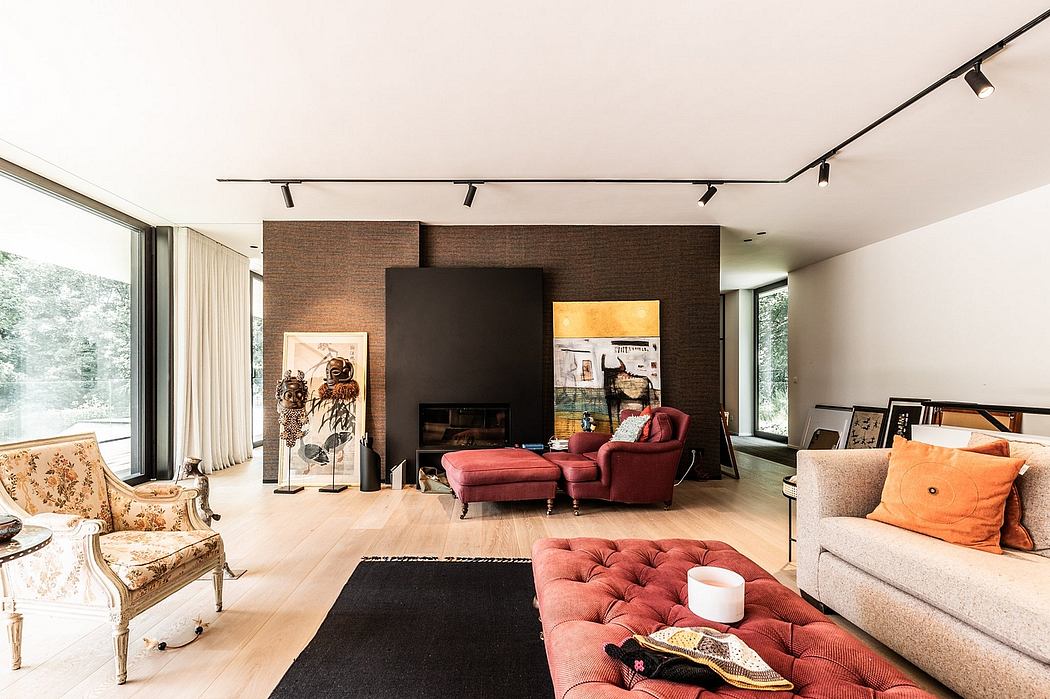 Warm, eclectic living space with brick walls, track lighting, and plush seating.