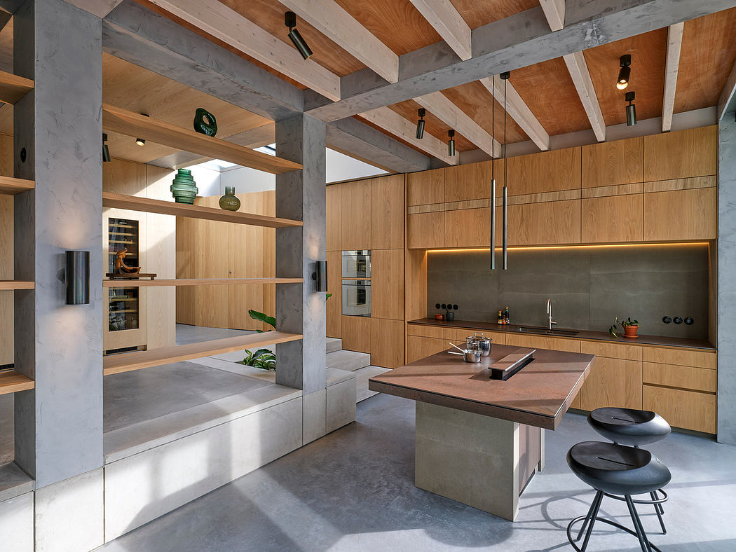 Sleek, modern kitchen with concrete and wood accents, open shelving, and island seating.