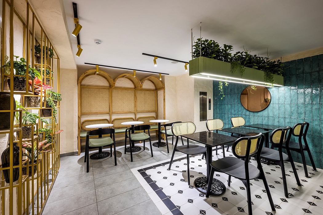Stylish modern cafe with arched rattan decor, geometric tile floors, and lush greenery.
