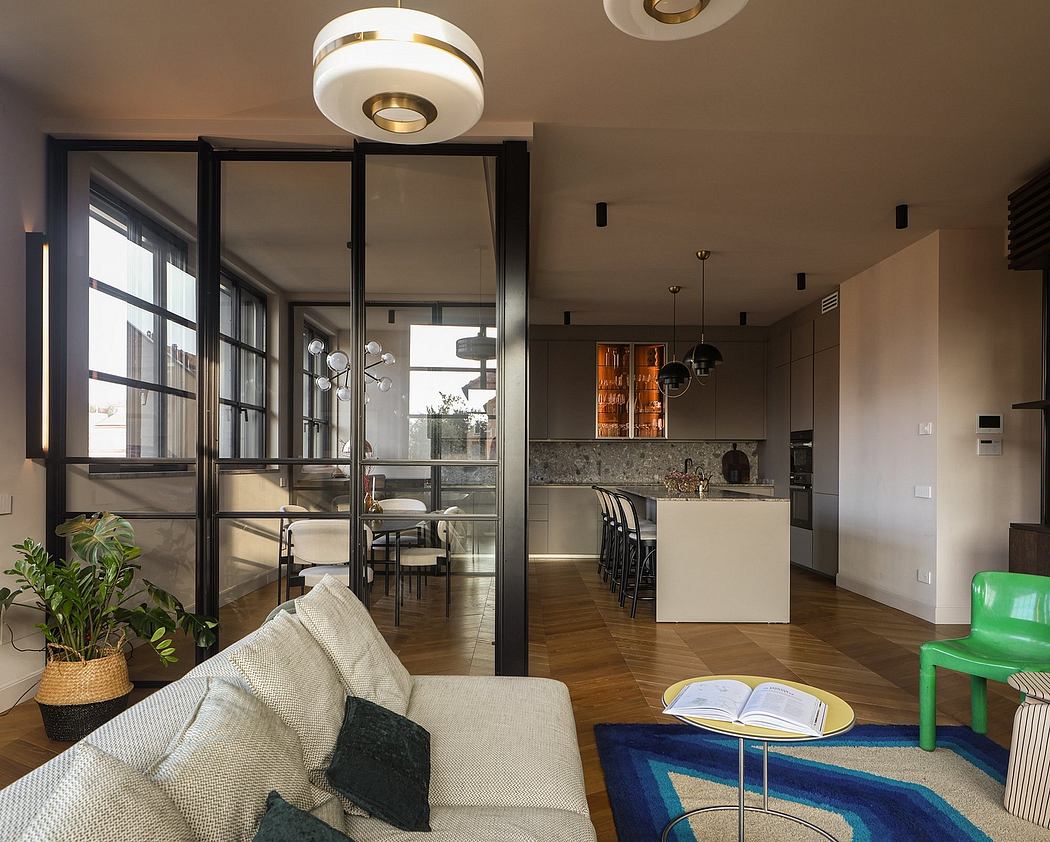 Spacious open-concept living area with contemporary lighting, glass partitions, and modern furnishings.