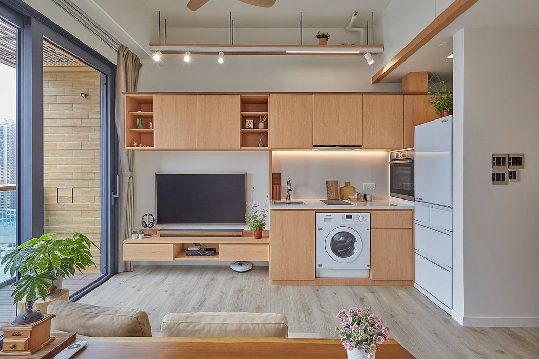 Modern open-concept apartment with wood accents, built-in storage, and appliances.