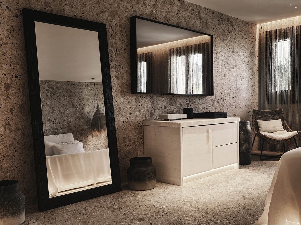 A sleek, modern bathroom with granite walls, a large mirror, and minimalist cabinetry.