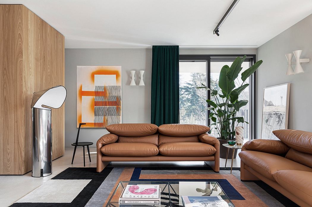 Sleek, modern living room with leather sofas, abstract artwork, and lush greenery.