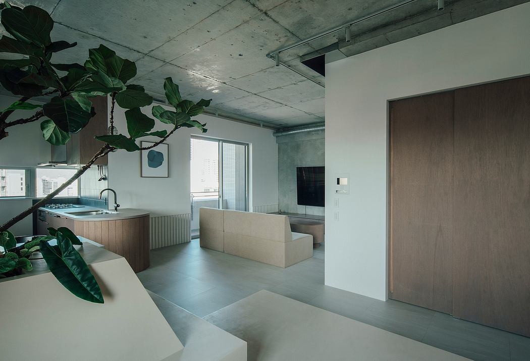 A minimalist and cozy living space with natural elements, concrete walls, and geometric shapes.