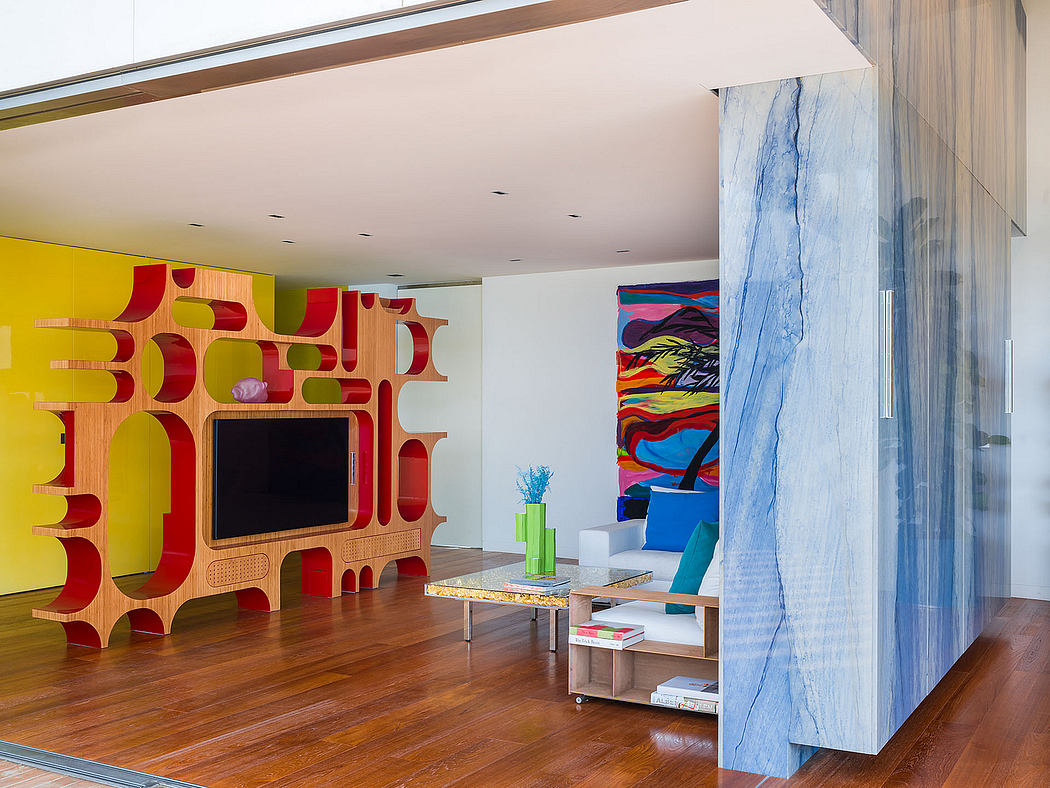 A vibrant, modern living space with a colorful abstract wall unit and textured decor.
