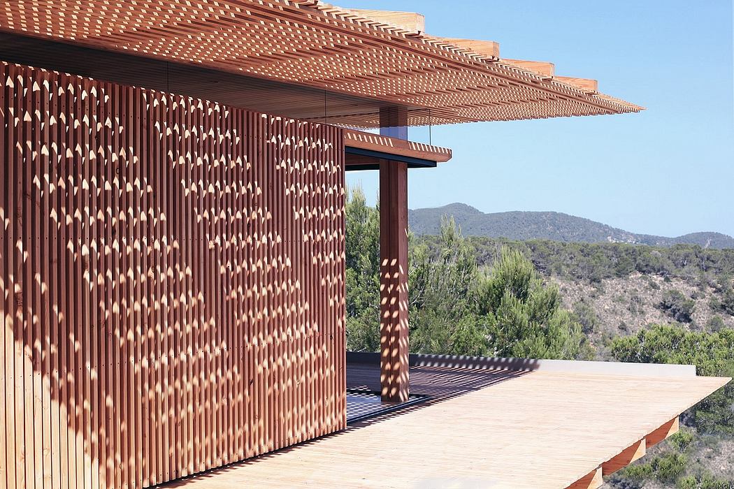 Striking geometric wood paneling with a sweeping mountain view backdrop.