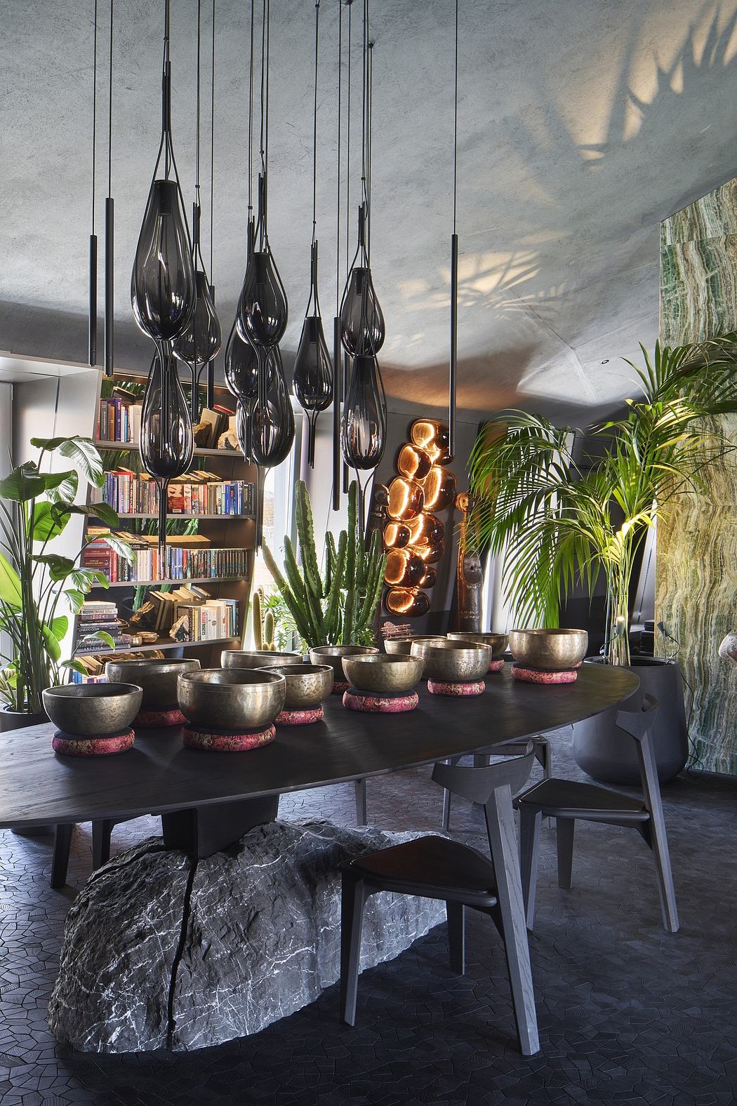 Dramatic lighting, earthy colors, and natural materials create a stylish, organic interior.