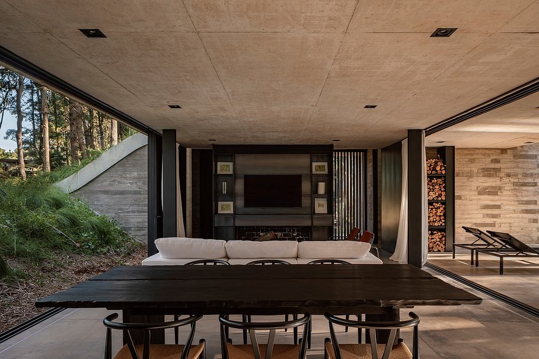 Rustic modern interior with concrete ceiling, timber, and built-in shelving.