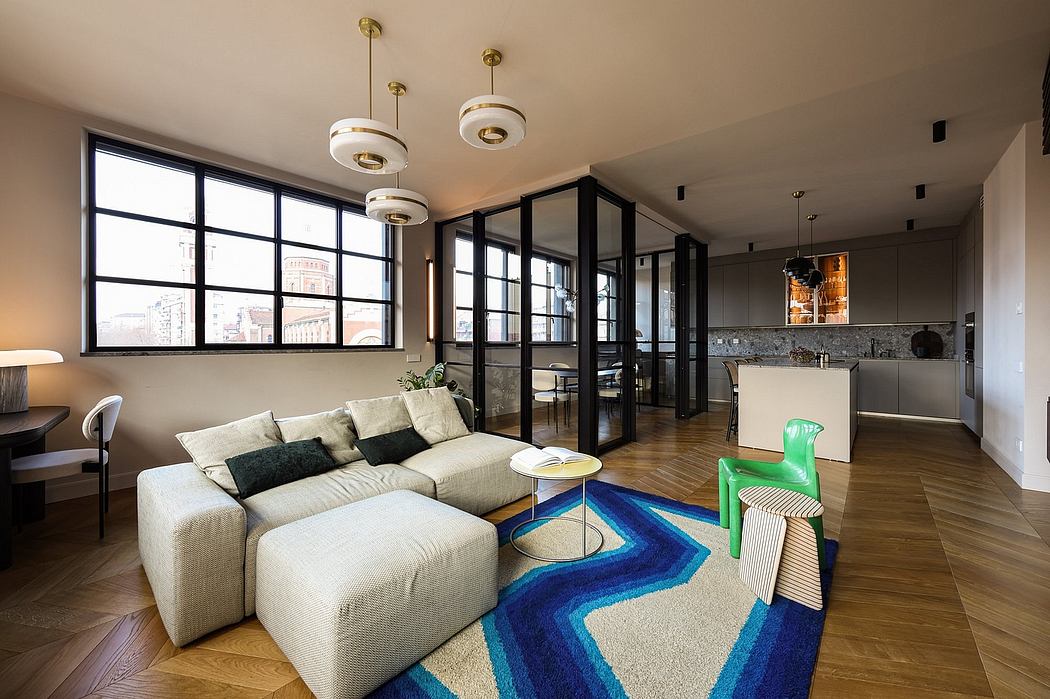 Modern open-concept living space with large windows, geometric rug, and pendant lighting.