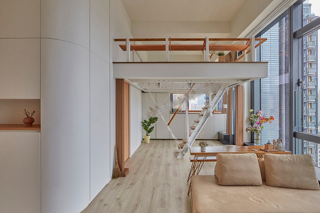 Bright, open-concept interior with wooden beams, mezzanine, and large windows overlooking a city.