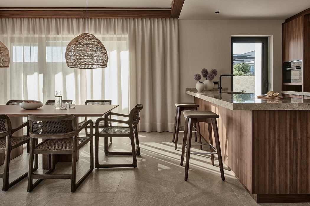 Warm, earthy-toned open-plan kitchen and dining area with natural materials.