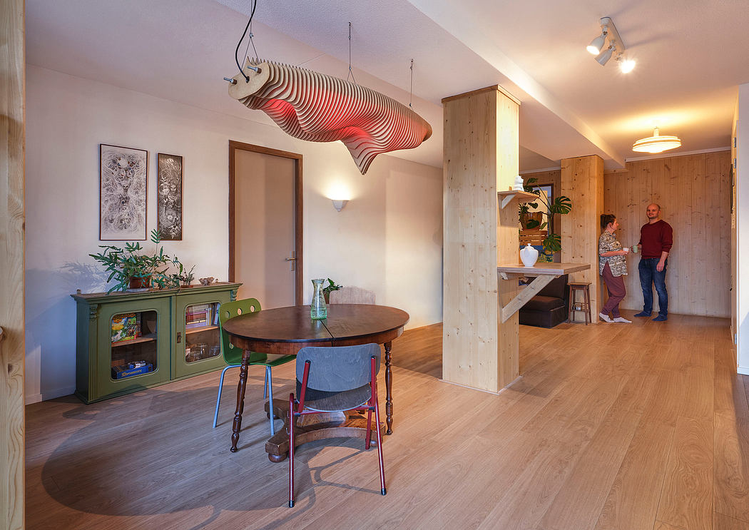 Eclectic dining area with wooden accents, circular pendant lighting, and antique furnishings.