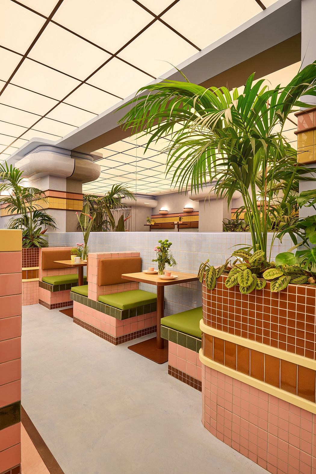 Tropical-inspired interior with vibrant tiles, planter boxes, and cozy seating.