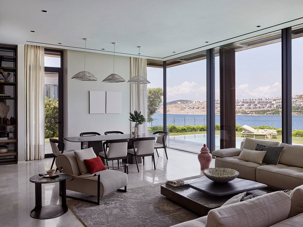 Chic, minimalist living room with floor-to-ceiling windows showcasing stunning lake view.