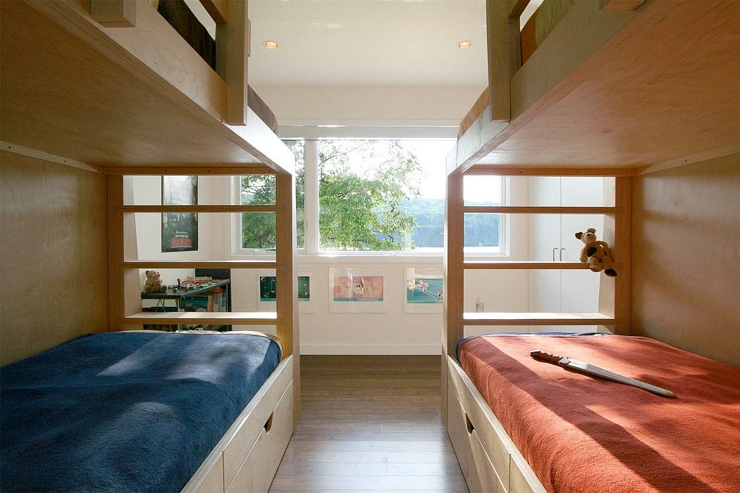 Cozy bunk beds with abundant storage and large windows, creating a warm, inviting space.