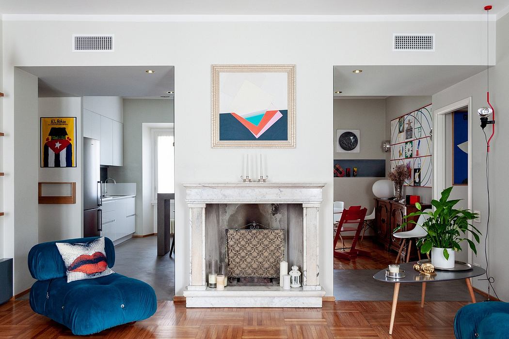 Airy, modern living space with marble fireplace, vibrant artwork, and eclectic decor.